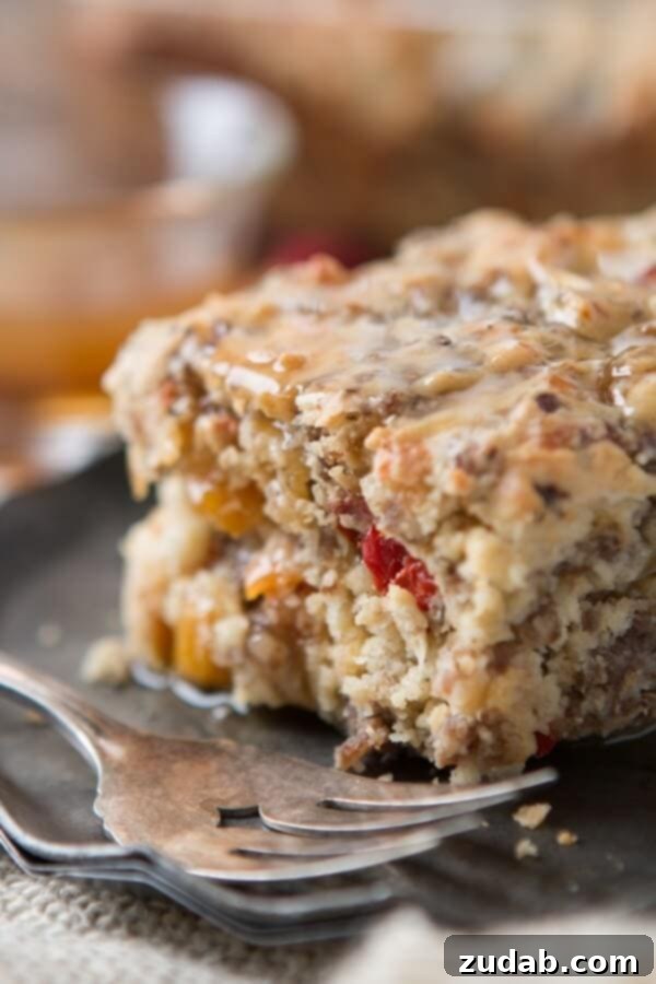 Southern Sausage Breakfast Cake with Maple Butter Sauce Southern Sausage Breakfast Cake with a generous drizzle of Maple Butter Sauce, a delicious savory breakfast alternative.