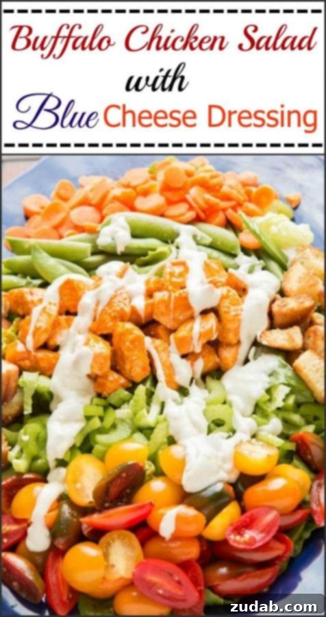 Gourmet Buffalo Chicken Salad Presentation A beautifully plated Buffalo Chicken Salad, featuring crisp greens, colorful vegetables, tender buffalo chicken, and a generous topping of crunchy Hawaiian Sweet Roll croutons.