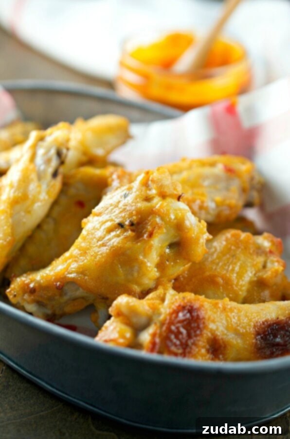 Spicy Buffalo Chicken Creamy Blue Cheese Salad 4 Crispy baked chicken wings generously tossed in a glistening sweet hot mustard sauce, presented as a delectable appetizer or meal.