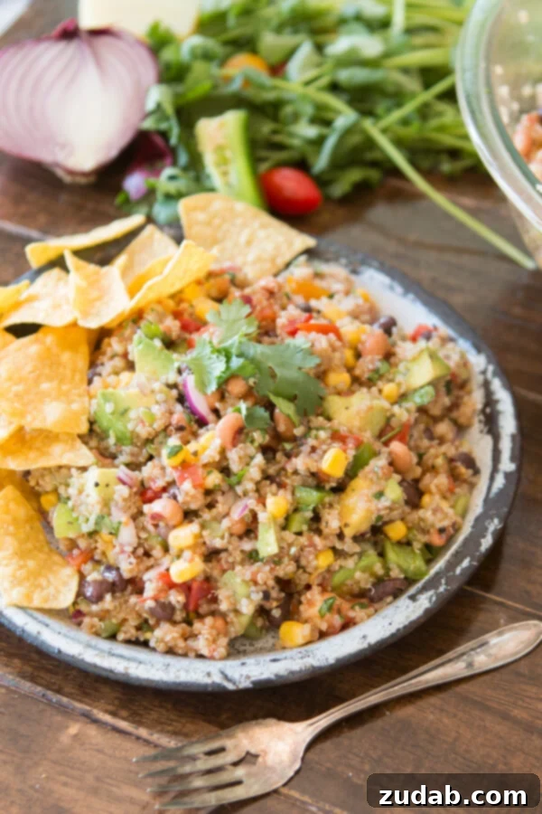 Cowboy Caviar Quinoa - A Healthy Summer Mashup A vibrant bowl of Cowboy Caviar Quinoa, showcasing a mashup of classic salsa ingredients with healthy quinoa, perfect for a refreshing side dish.