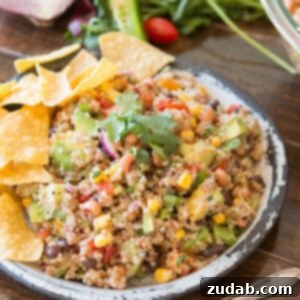 A vibrant bowl of Cowboy Caviar Quinoa, showcasing a mashup of classic salsa ingredients with healthy quinoa, perfect for a refreshing side dish.