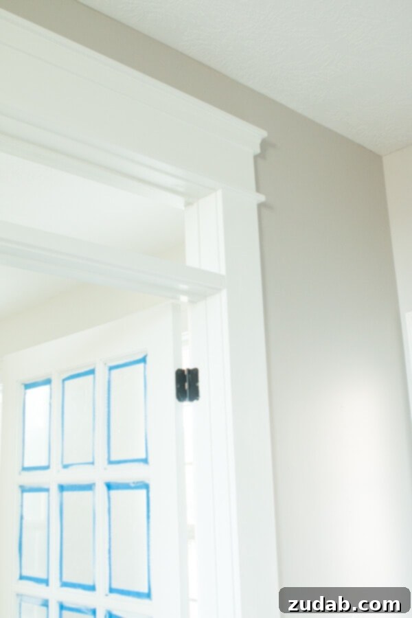 Architectural detail: transom over French doors for a brighter office. Transom window above French doors for added light and height in the home office.