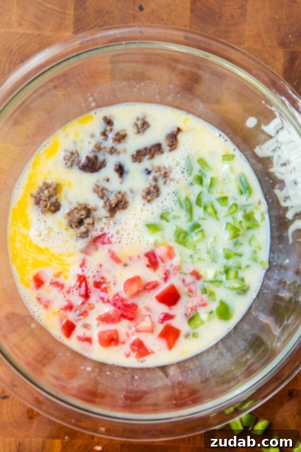 Make-Ahead Breakfast: Eggs in a Nest with Custom Fillings Preparing eggs in a nest with fresh vegetables and lean turkey sausage.