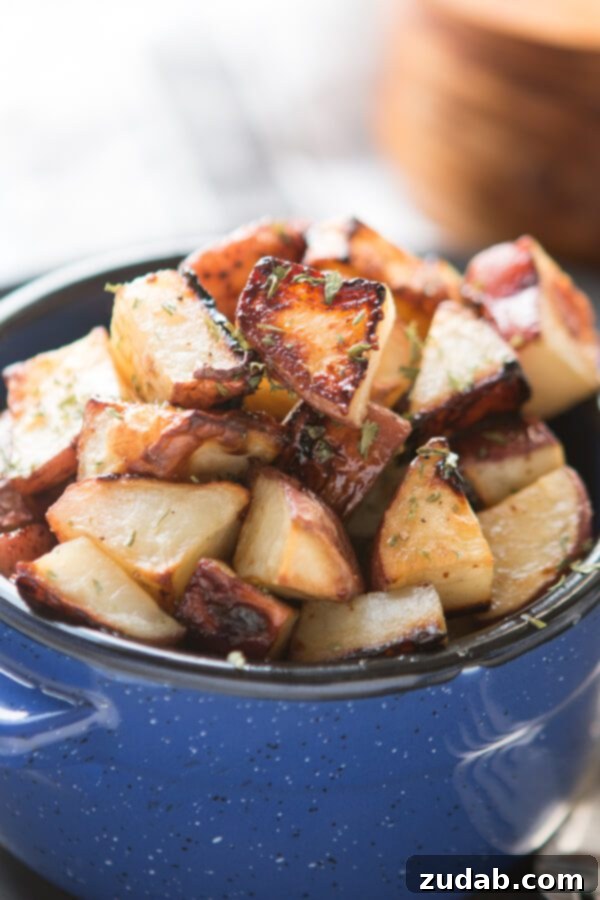 Crispy Ranch Roasted Potatoes 6 Close-up of honey-roasted red potatoes with a glossy, golden finish.