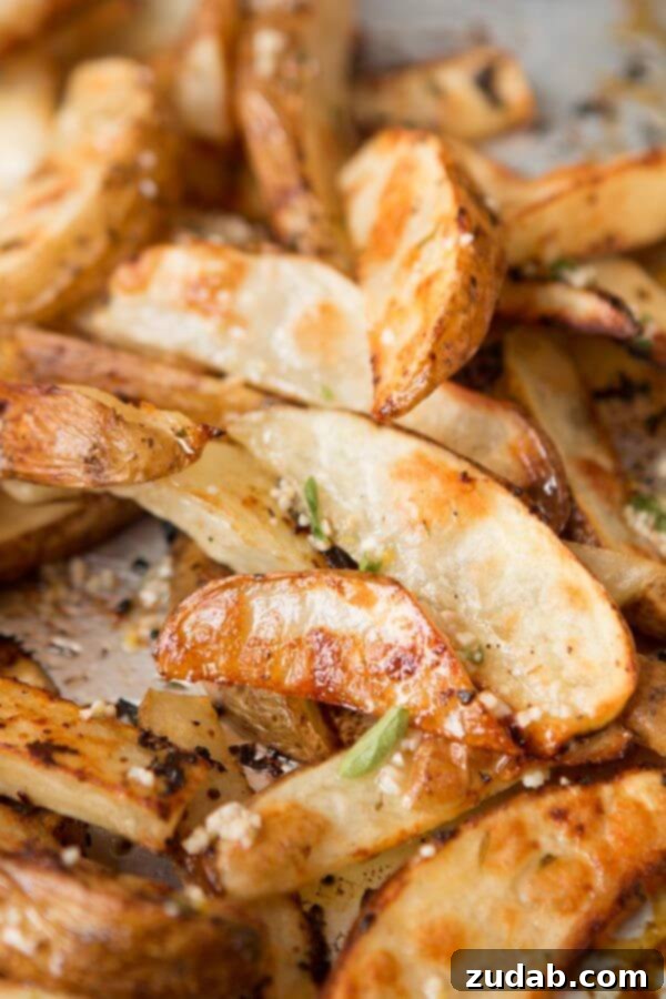 Crispy Ranch Roasted Potatoes 7 A rustic bowl of Lemon Roasted Potatoes, garnished with fresh herbs.