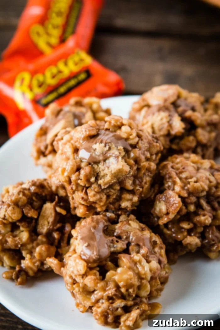 Reese's Peanut Butter Krispies Treats 3 Close-up shot of the rich, melted peanut butter and chocolate mixture, with crispy rice cereal just added, ready for the Reese's Peanut Butter Cups.