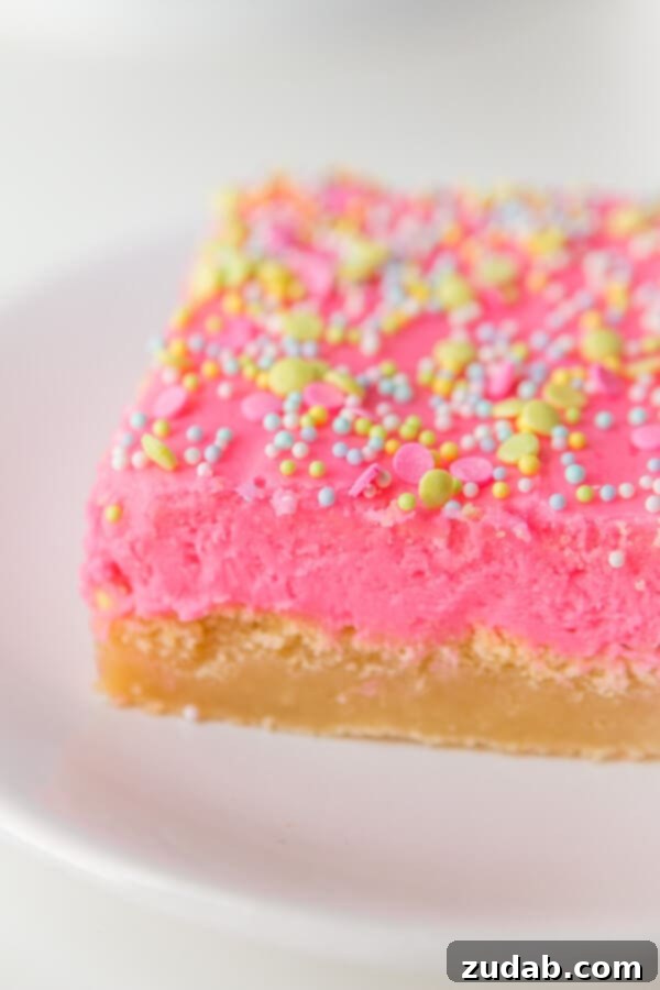 Soft Sugar Cookie Bars Recipe: A Family Favorite Soft sugar cookie bars decorated with pastel frosting and colorful sprinkles, perfect for holidays.
