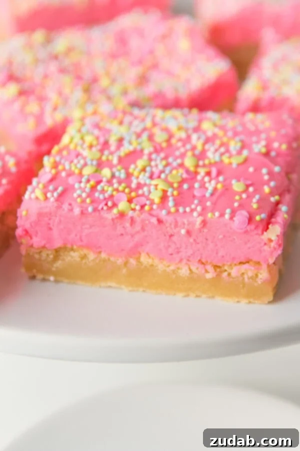 Soft and Chewy Sugar Cookie Bars Ready for Frosting Unfrosted soft sugar cookie bars, showcasing their fluffy and tender texture.