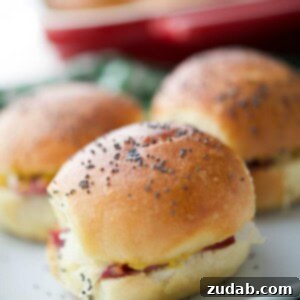 Golden Irish Melt Sliders 2 These Irish Sliders made with corned beef, melted Dubliner Irish cheese, sauerkraut and spicy Irish mustard on potato slider rolls are a must have for your next gathering.