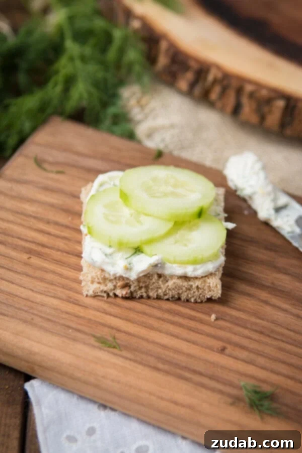 The best lemon dill cucumber sandwiches I've ever had added a touch of Greek yogurt to the spread. Try this awesome tea sandwich recipe at your next party with eureka!® Organic Bread! open faced cucumber tea sandwiches