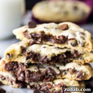 Fudge Lava Chocolate Chip Cookies 2 These fudge filled chocolate chip cookies are simple, classic chocolate chip cookies with a decadent chocolate fudge filling on the inside! These surprise-inside cookies are sure to be a new favorite! ohsweetbasil.com