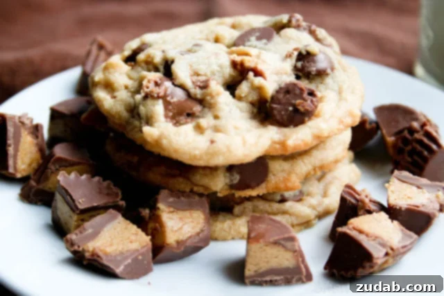 Ultimate Reese's Peanut Butter Cup Cookies 2 Delicious Reese's Peanut Butter Cup Cookies, freshly baked and arranged on a cooling rack.