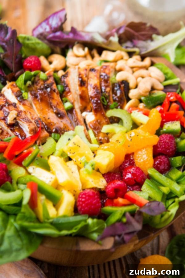 Easy Teriyaki Chicken Salad: Juicy Chicken, Veggies, Fruit & Cashews with Poppy Seed Dressing A vibrant teriyaki chicken salad, featuring juicy chicken, colorful vegetables, sweet fruits, and crunchy cashews, all perfectly dressed with a poppy seed dressing.