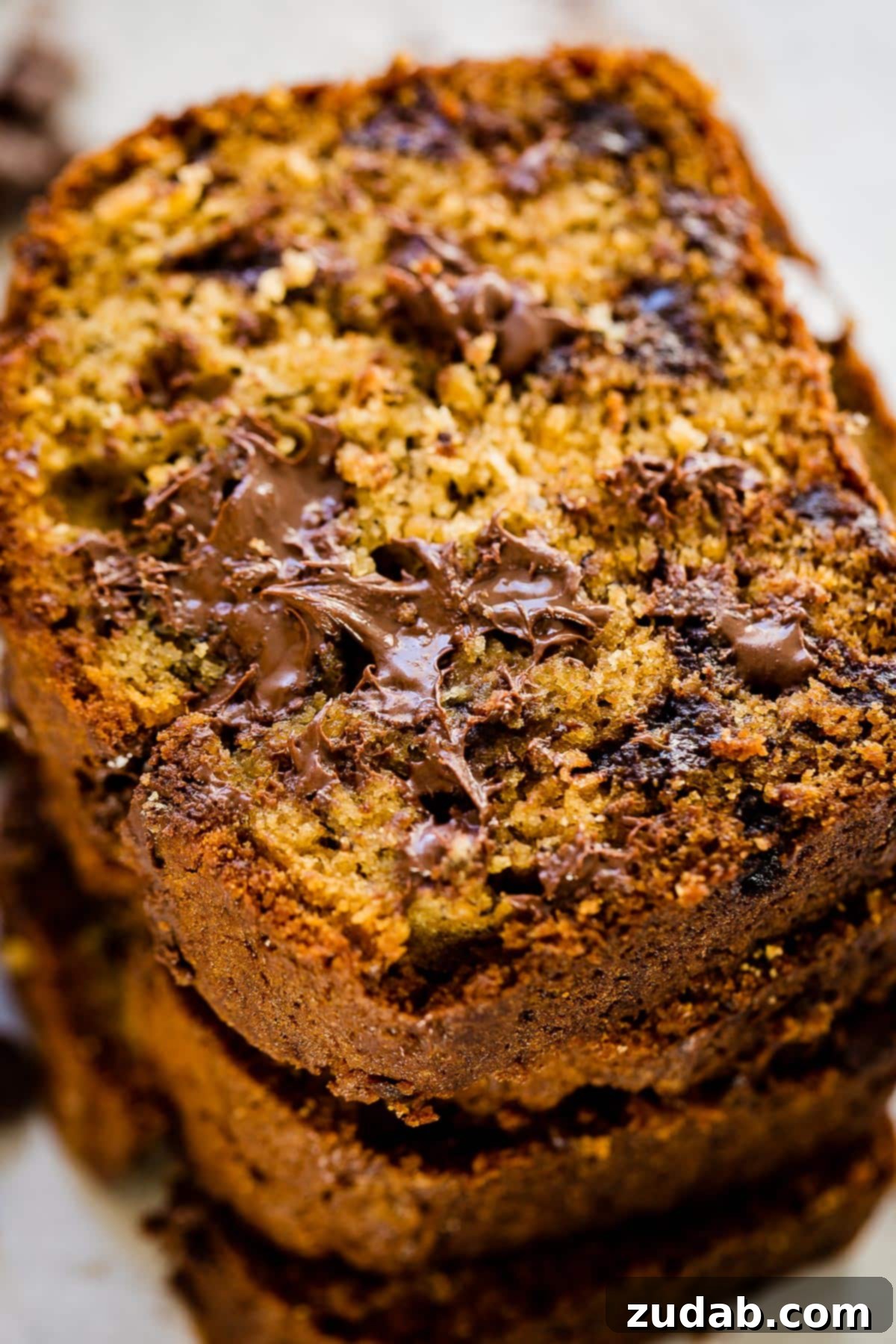 Ultimate Biscoff Banana Bread 2 A perfectly baked loaf of Biscoff Banana Bread, showcasing its golden-brown crust and moist interior, ready to be sliced and enjoyed.