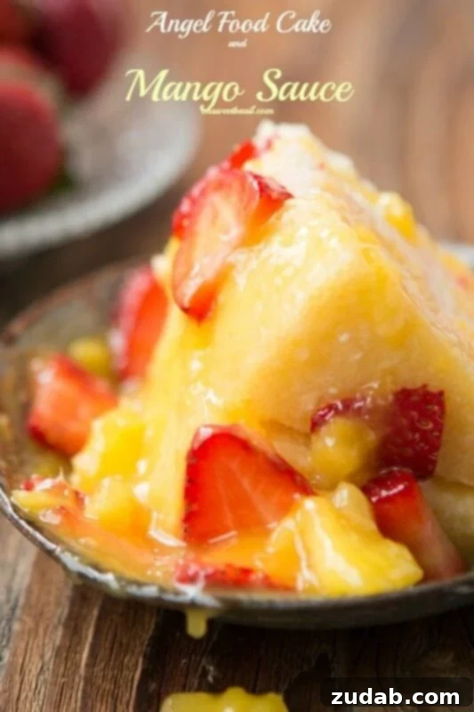 Irresistible Angel Food Cake with Homemade Mango Sauce Luscious Angel Food Cake with Homemade Mango Sauce and Fresh Strawberries