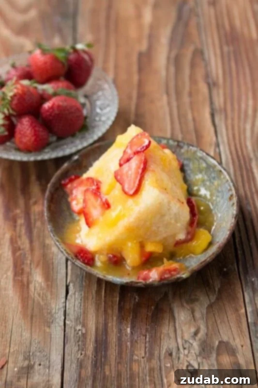 Delicious Angel Food Cake with Smooth Mango Sauce Closeup of Fluffy Angel Food Cake with Golden Mango Sauce Drizzle
