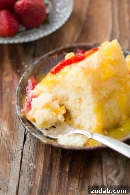 Simple and Delicious Angel Food Cake with Mango Topping Freshly Sliced Angel Food Cake with a Generous Pour of Mango Sauce