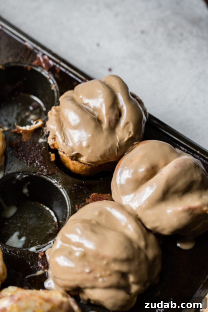 Irresistible Maple Glazed Cinnamon Butterflake Rolls 5 An old muffin tin filled with maple cinnamon butterflake rolls