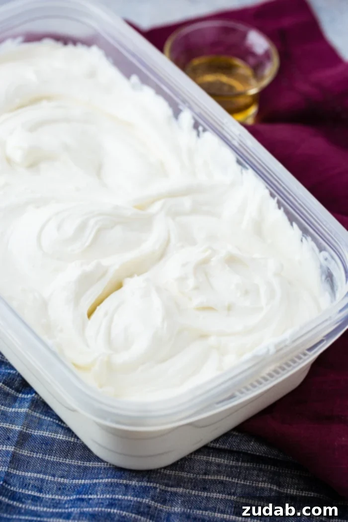 Homemade Instant Pot Yogurt 4 instant pot Homemade yogurt in a tupper ware container with a small serving of honey
