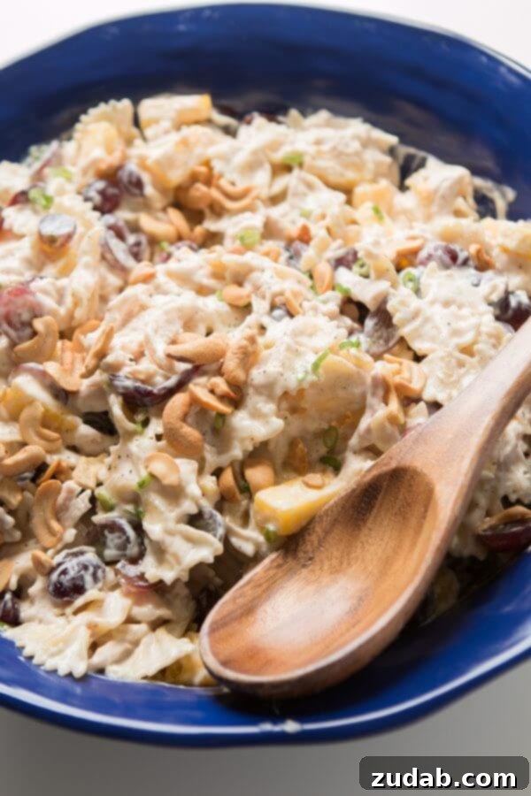 Bowtie chicken pasta salad is perfect for a BBQ. Creamy dressing, juicy pineapple and grapes, crunchy cashews and lots of chicken! Bowtie chicken pasta salad is perfect for a BBQ. Creamy dressing, juicy pineapple and grapes, crunchy cashews and lots of chicken!