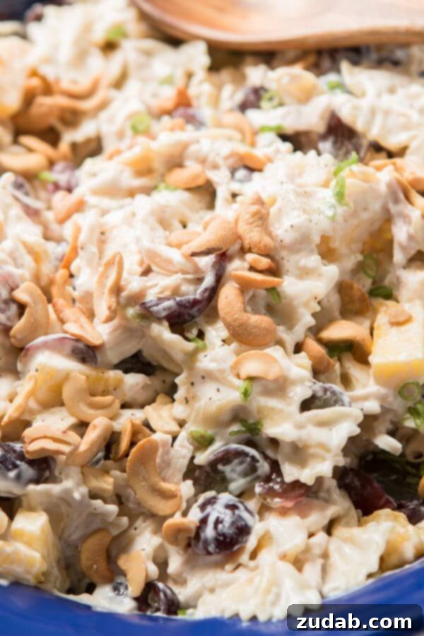 Bowtie chicken pasta salad is perfect for a BBQ. Creamy dressing, juicy pineapple and grapes, crunchy cashews and lots of chicken! Bowtie chicken pasta salad is perfect for a BBQ. Creamy dressing, juicy pineapple and grapes, crunchy cashews and lots of chicken!