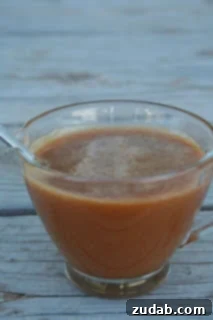 Rich and creamy homemade caramel sauce drizzled over a dessert