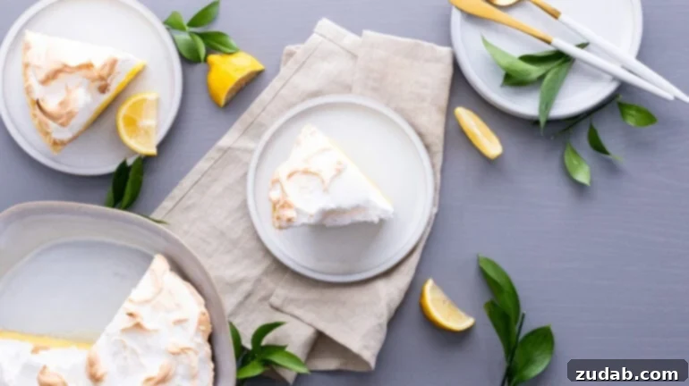 Mom's Secret Lemon Meringue Pie 10 An inviting overhead photo capturing a single, elegant slice of pie resting on a simple white dessert plate.