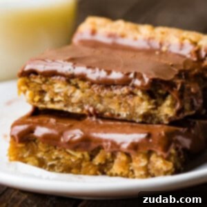 Irresistible Peanut Butter Bars 8 A delicious square Peanut Butter Bar with chocolate frosting on top.