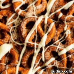 Easy 4-Ingredient Cinnamon Sugar Pretzels 7 Close-up of cinnamon sugar pretzels with white chocolate drizzle.