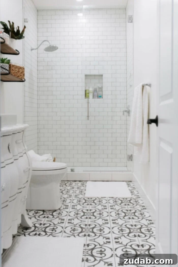 Basement Bathroom Transformation With The Best Tile of 2018 2 Black and white tile bathroom with a dresser turned into a vanity and a tall infinity glass shower with white subway tile, a perfect blend of vintage and modern for any guest!