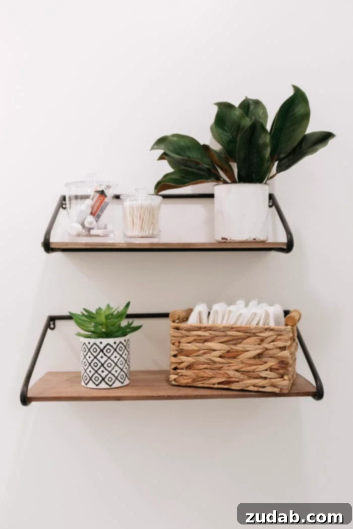 Basement Bathroom Transformation With The Best Tile of 2018 11 Final detailed shot of the black and white guest bathroom, highlighting the curated decor and essential amenities.
