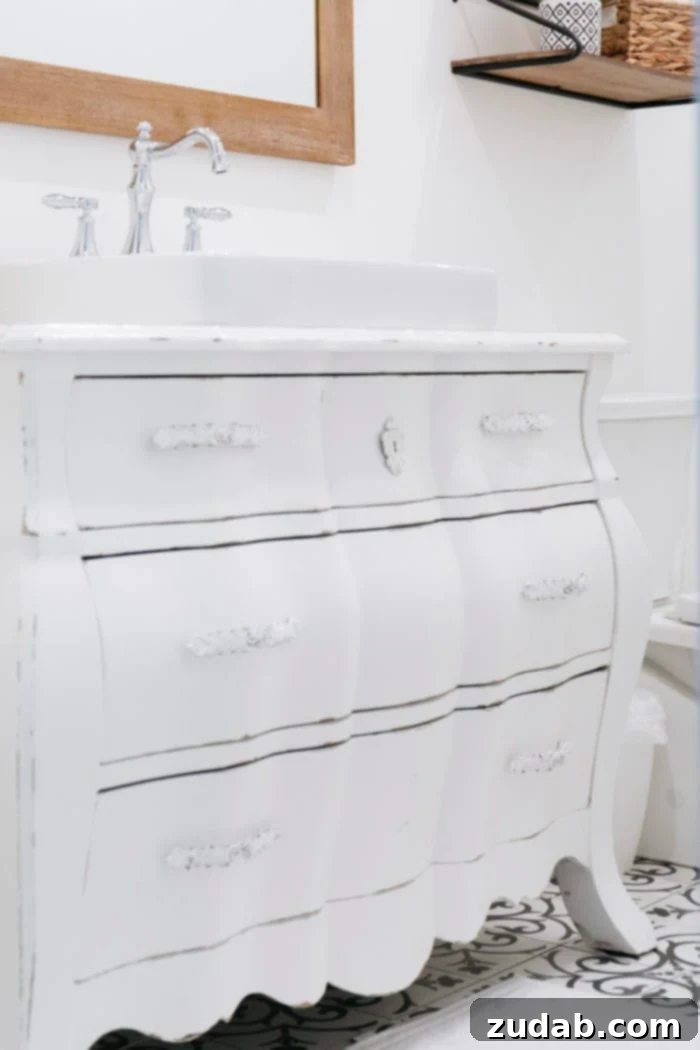 Basement Bathroom Transformation With The Best Tile of 2018 4 A vintage white dresser ingeniously repurposed as a bespoke bathroom vanity, with custom drawer cut-outs for plumbing.