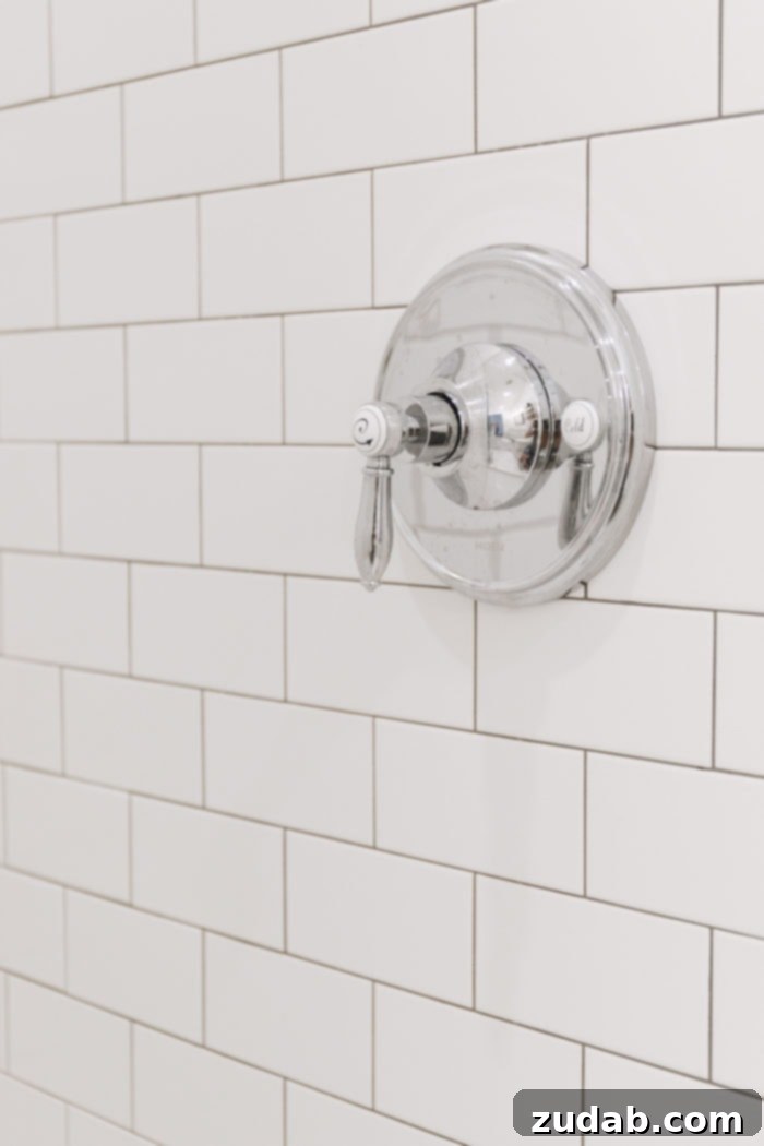 Basement Bathroom Transformation With The Best Tile of 2018 8 Detailed shot of the custom DIY vanity area, featuring the repurposed dresser, sink, and stylish fixtures.