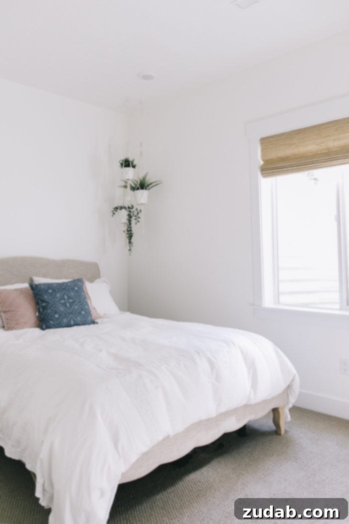 Stunning Basement Bedroom Makeovers 18 A final detailed shot of the guest bedroom, capturing the essence of the design with a focus on specific elements that enhance comfort and style. The room invites relaxation and showcases the blend of modern and traditional touches.