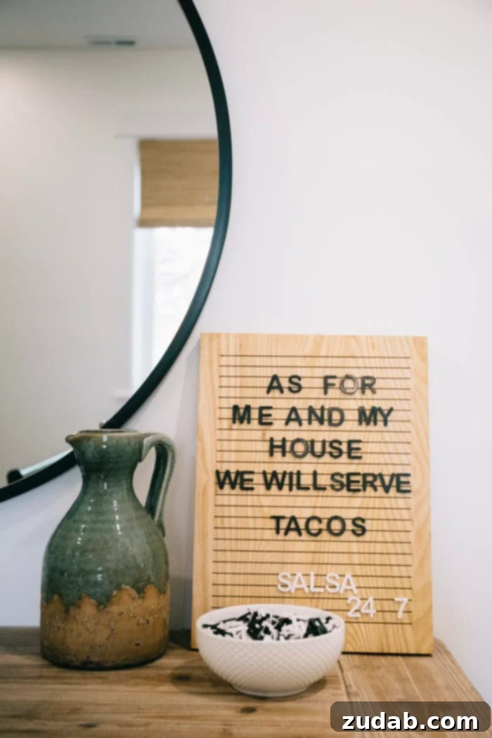 Stunning Basement Bedroom Makeovers 8 A stylish Emerie Lane letter board made of wood, displaying a playful quote about tacos, adding a personalized and fun element to the guest bedroom decor.