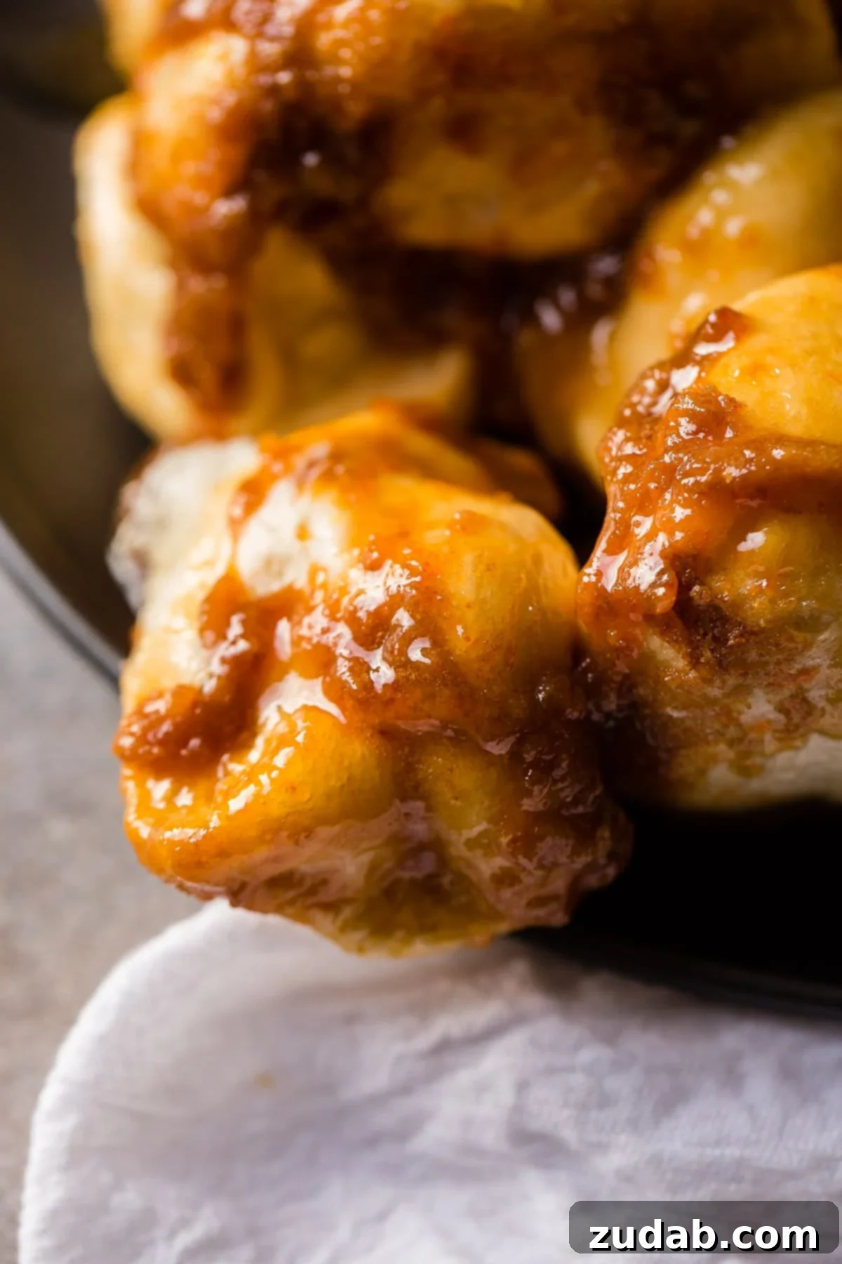 Mom's Legendary Sticky Buns 4 Plate of warm Mom's Sticky Buns, glistening with a rich butterscotch-caramel glaze.