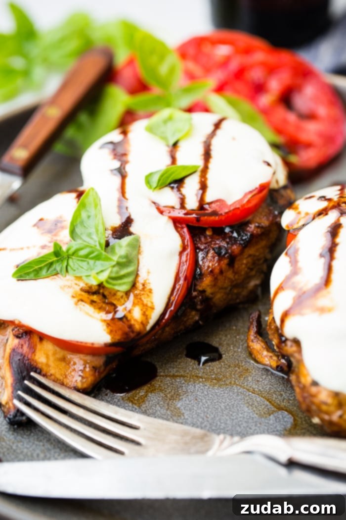 Balsamic Caprese Chicken close-up, showcasing the melted mozzarella and fresh basil