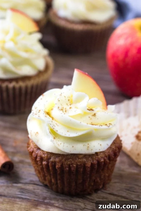 Fragrant Spice Cupcakes with Zesty Cinnamon Cream Cheese Frosting 10 Delicious apple cupcakes topped with creamy cream cheese frosting, featuring warm spices, grated apple, and a perfectly tangy finish.