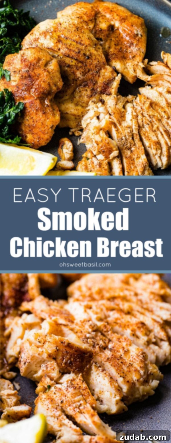 Juicy Traeger Smoked Chicken Breast, Effortlessly 8 A photo of whole smoked chicken breasts and sliced smoked chicken breasts on a charcoal gray plate with lemon wedges and kale on the side.