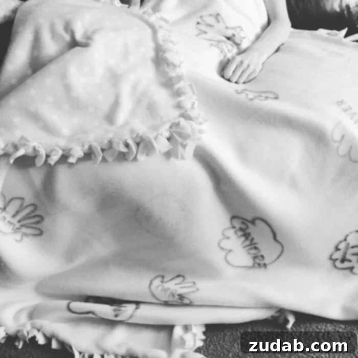 The Unseen Battle for Belief 2 A person resting under a handmade blanket adorned with handprints, symbolizing comfort and care during a challenging time.