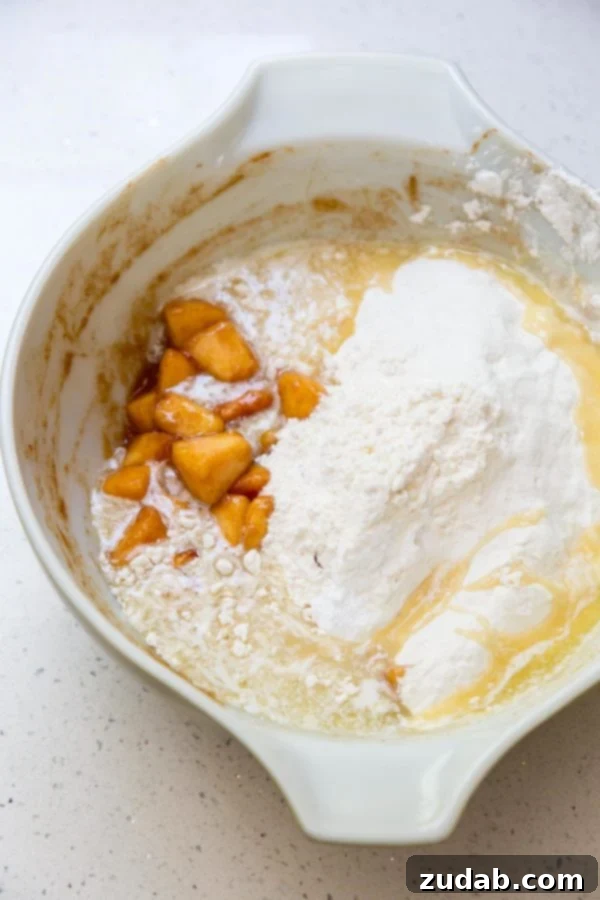 Golden Peach Butter Cake 3 Fresh peach dump cake ingredients in a large mixing bowl