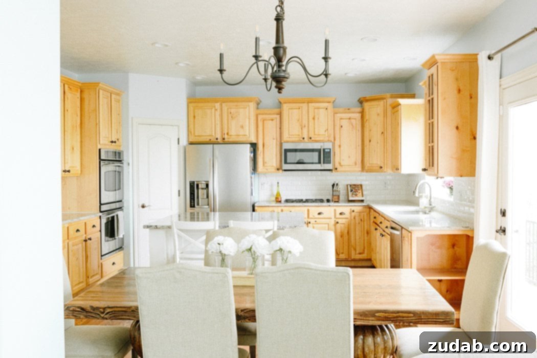 Pre-renovation kitchen revealing worn cabinets, old appliances, and poor layout