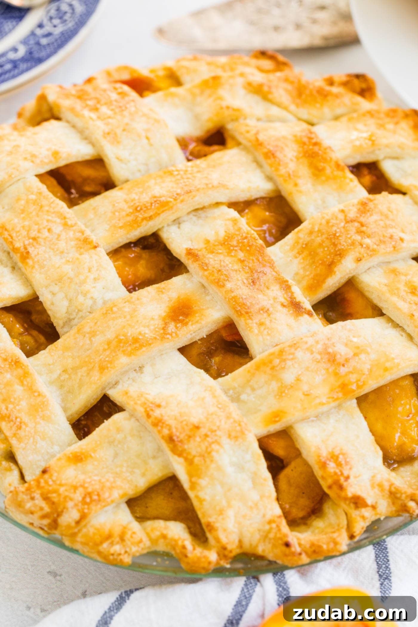 Fresh Peach Pie with Lattice Crust A photo of a fresh peach pie with lattice crust.