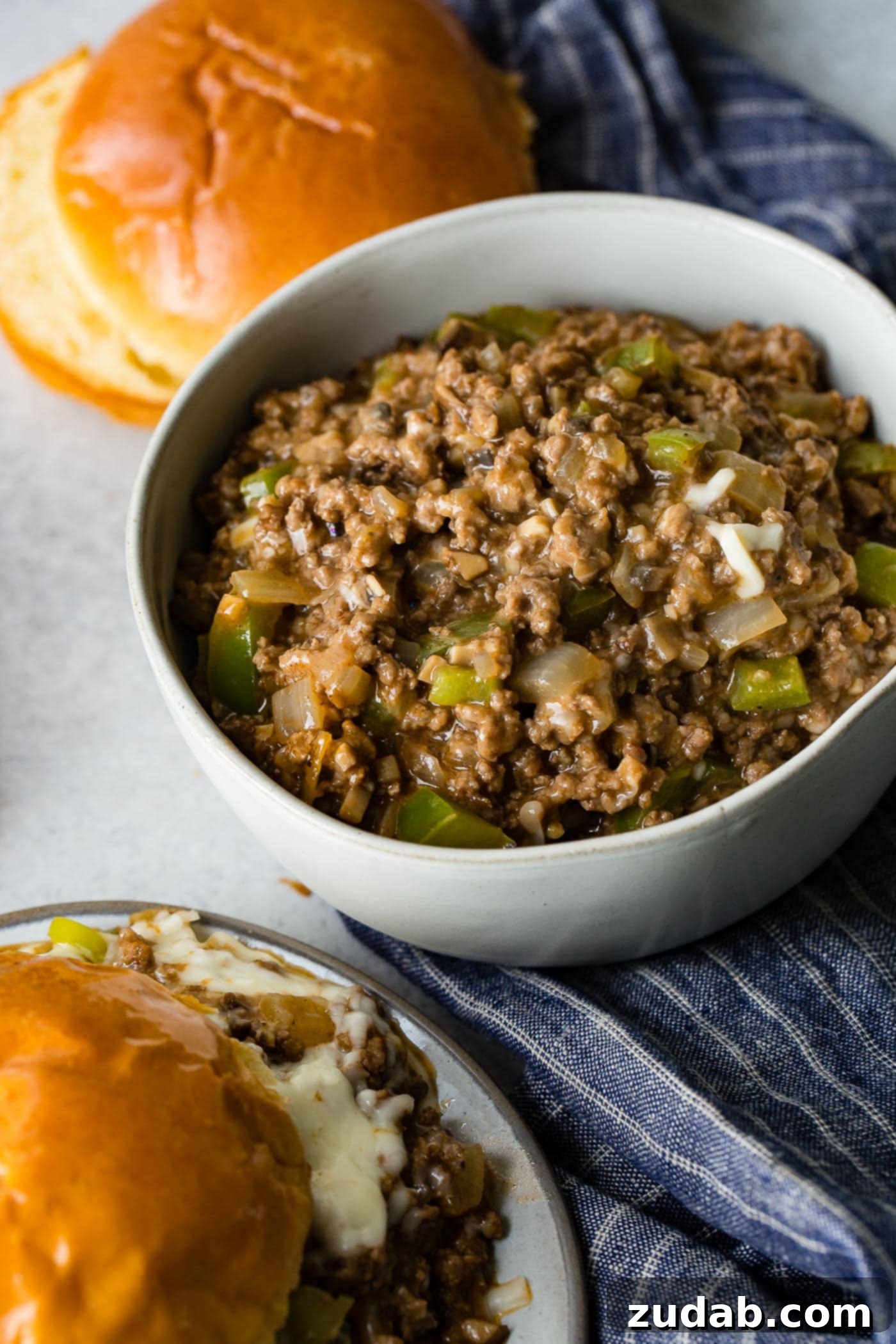 Philly Cheesesteak Sloppy Joes A photo of the philly cheesesteak sloppy joe mixture in a while bowl ready to add to the buns.