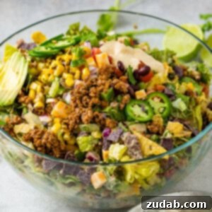 A mouth-watering image of the finished Chopped Tex-Mex Ground Beef Taco Salad, ready to be served.