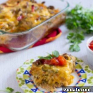 Mexican Breakfast Enchiladas: A hearty and flavorful casserole with whole wheat tortillas, eggs, sausage, peppers, and cheese.