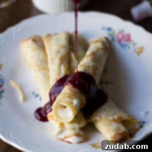 Marionberry Strawberry Syrup served over the most delicious cream filled crepes. #Breakfast at our house is amazing. ohsweetbasil.com_-3