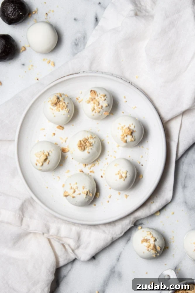Decadent Oreo Peanut Butter Balls 4 Homemade Oreo Peanut Butter Truffles on parchment paper