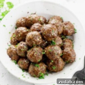 Mom's Easy Classic Meatball Recipe 2 A close-up shot of juicy homemade meatballs, perfectly browned and ready to be added to your favorite sauce.