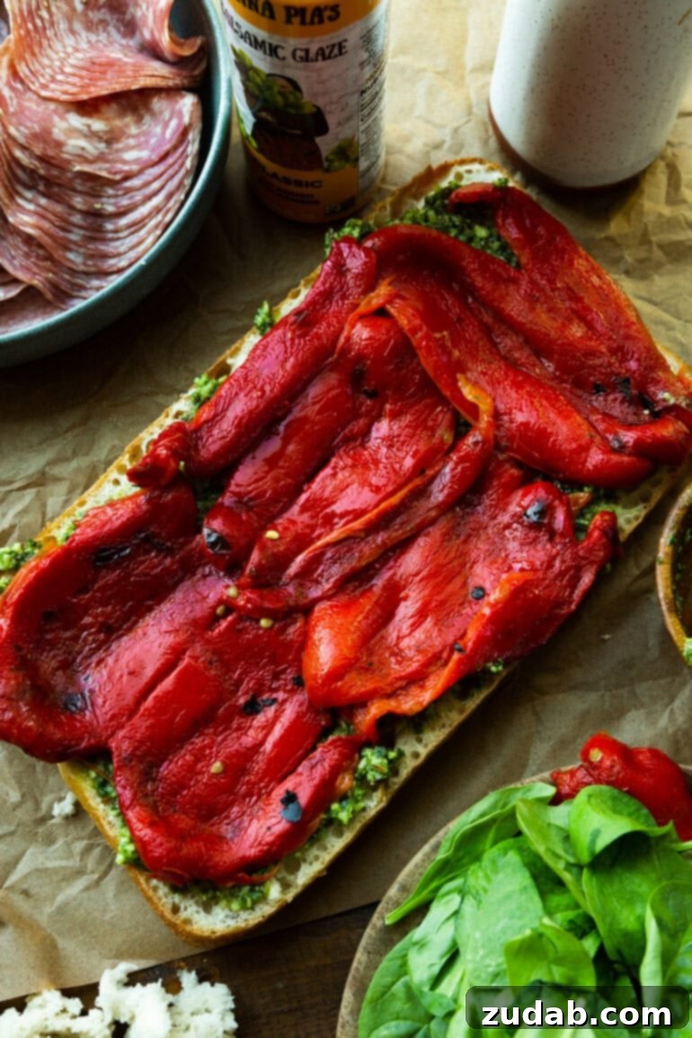 Italian Panini 6 Step-by-step image of layering tomatoes and roasted red peppers.